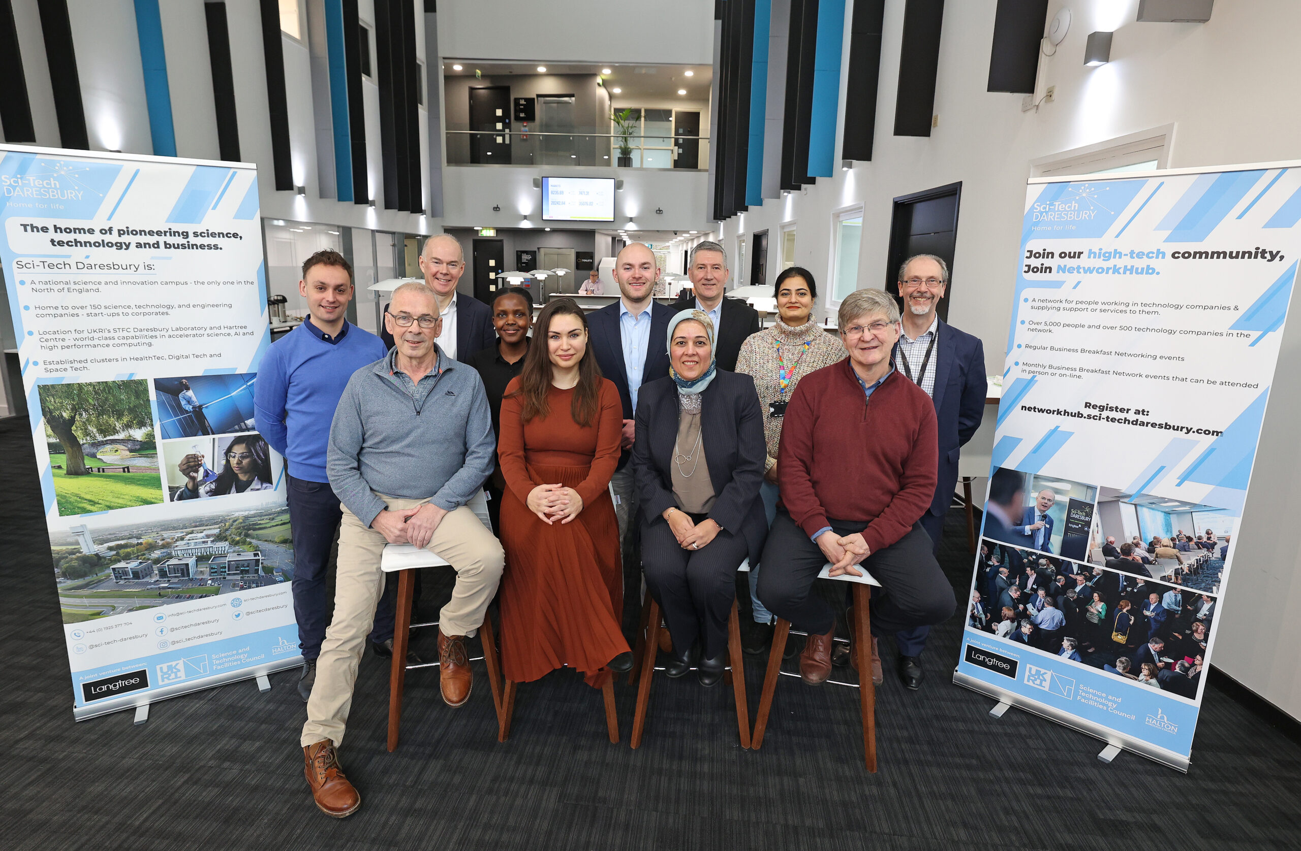 Group of people smiling - Future Club and Sci-Tech Daresbury Representatives.